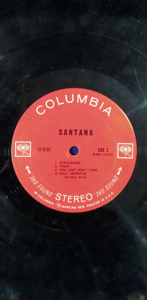 Santana - CS 9781 - LP Record, Condition - 85% --- Label: Columbia – CS 9781 Format: Vinyl, LP, Album, Stereo Pays: US Sortie: Aug 1969 Genre: Rock, Latin, Funk / Soul Style: Afro-Cuban, Psychedelic Rock A1 Waiting Written-By – Santana Band* 4:07 A2 Evil Ways Written By – J. Zack Written-By [Uncredited] – Clarence Henry 4:00 A3 Shades Of Time Written-By – Santana Band* 3:14 A4 Savor Written-By – Santana Band* 2:46 A5 Jingo Written By – A. Copland Written-By [Uncredited] – Babatunde Olatunji 4:23 B1 Persuasion Written-By – Santana Band* 2:37 B2 Treat Written-By – Santana Band* 4:46 B3 You Just Don't Care Written-By – Santana Band* 4:37 B4 Soul Sacrifice Written-By – Santana Band 6:38
